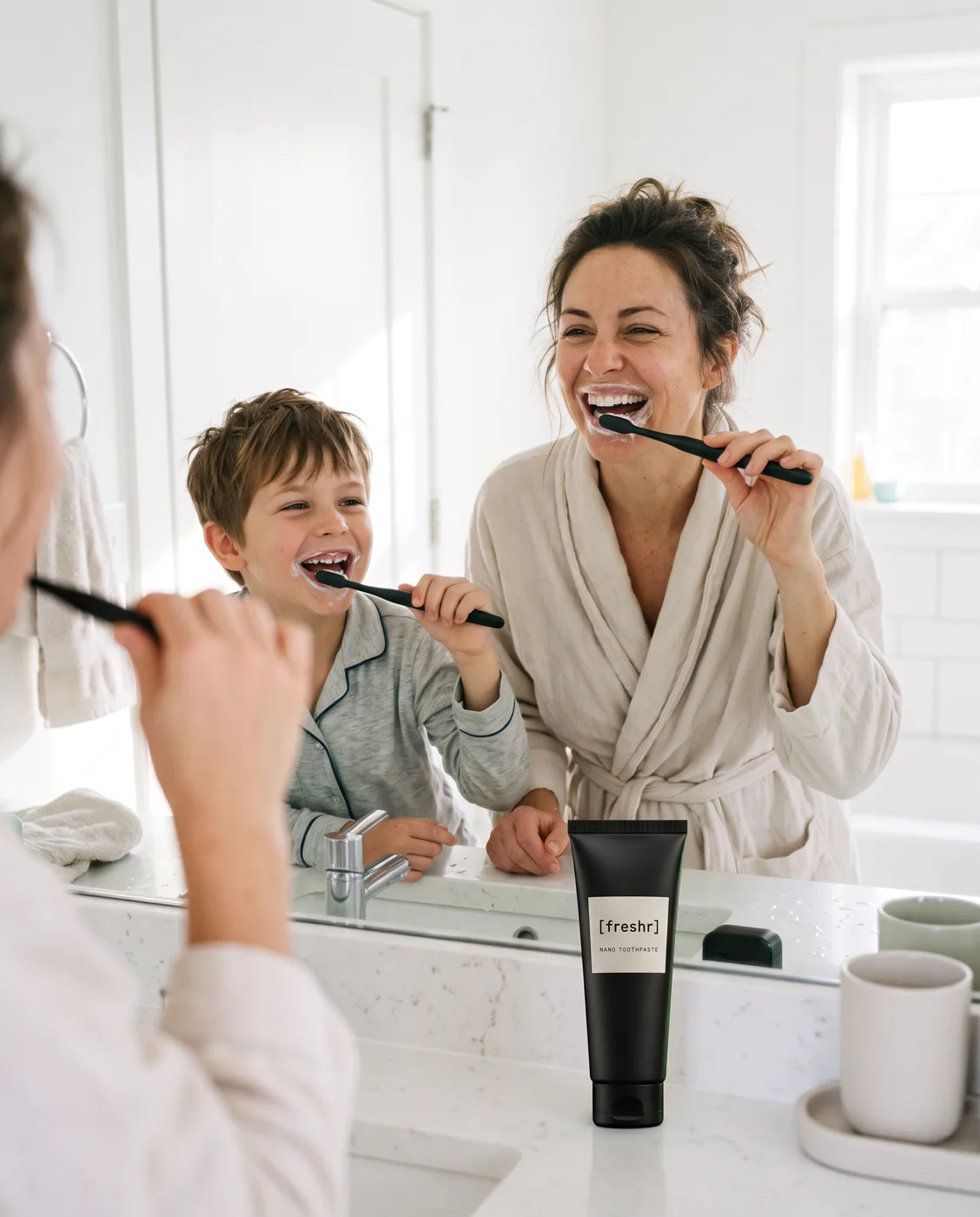 Mum and son brushing their teeth with the Freshr nano brush