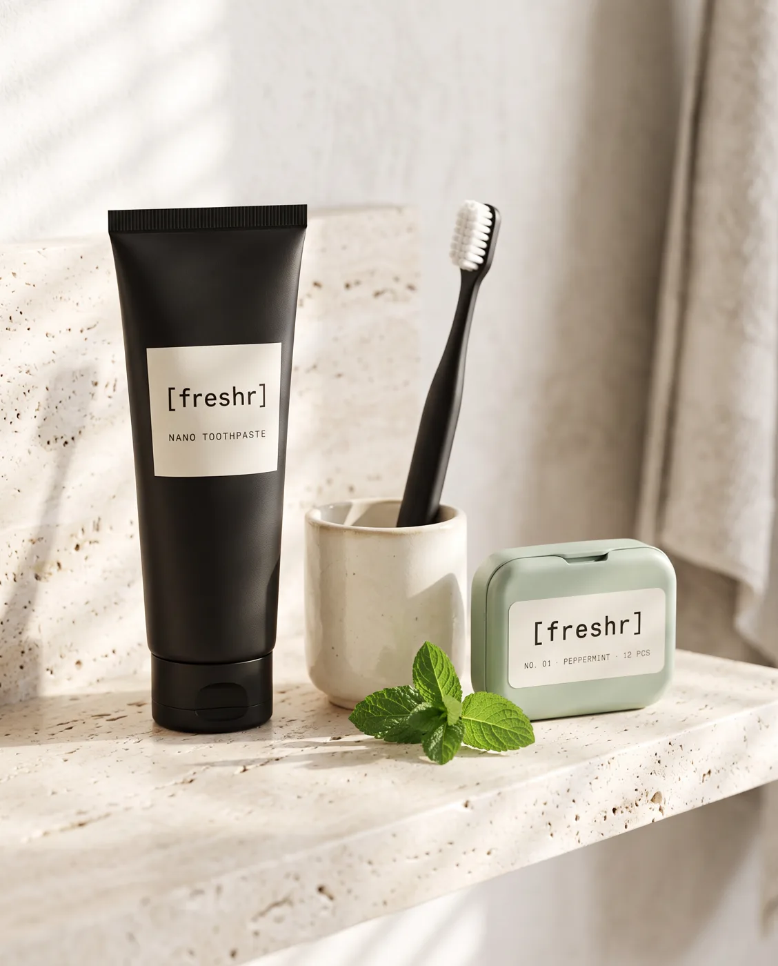 Freshr nano toothpaste, nano brush and gum tin on a bathroom shelf